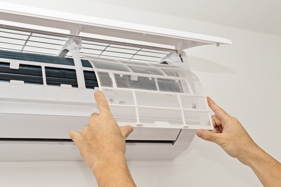 Changing the filter in the air conditioner. Ductless maintenance.