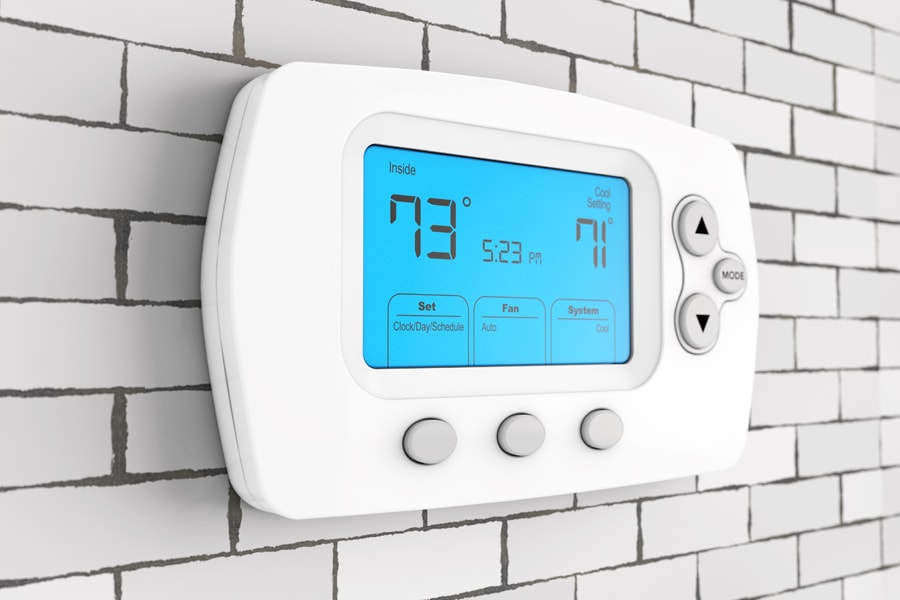 Modern Programming Thermostat in front of Brick Wall. 3d Rendering.