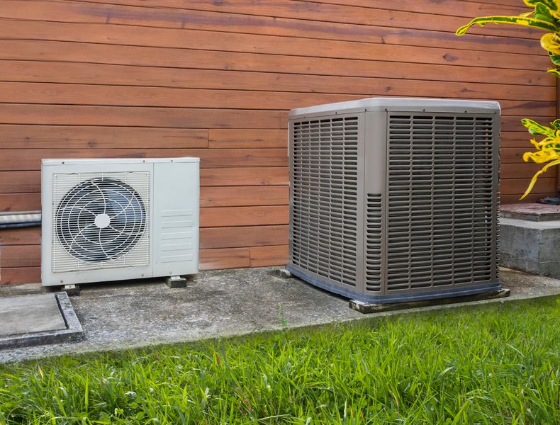 Transitioning Your Heat Pump. Image shows heat pump on home exterior.