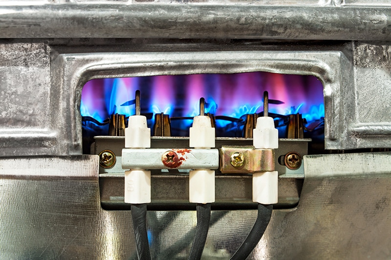 Close-up of a furnace pilot light.